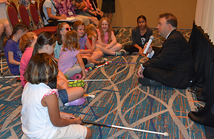 President Mark Riccobono sits on the floor to talk with the kids at the beginning of the many parent sessions that made up the 2018 National Convention.